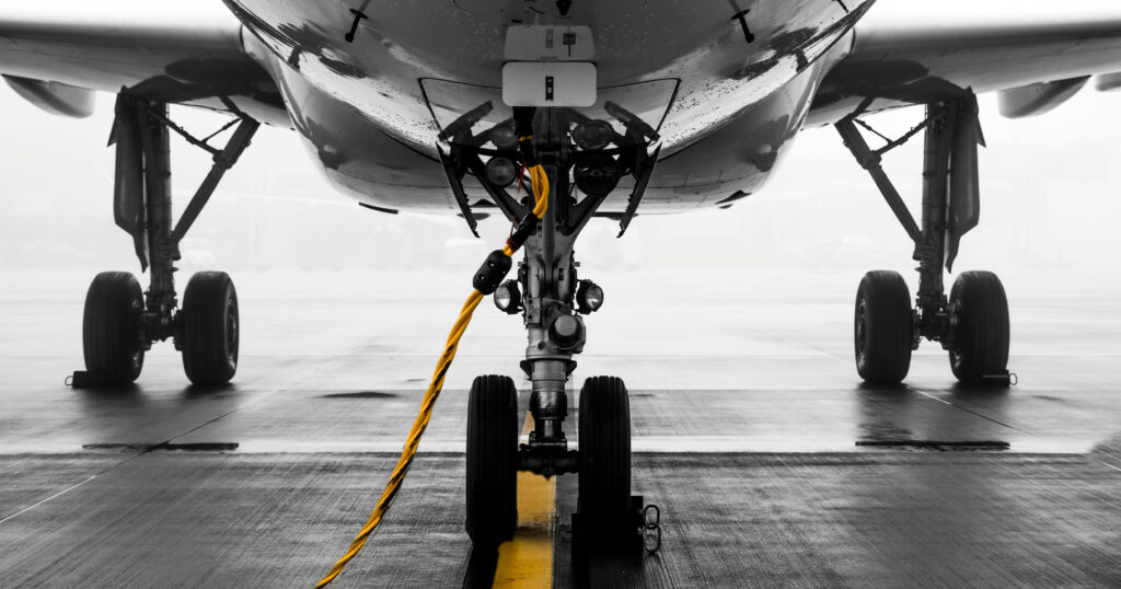 Military aircraft refuelling mid-air during an aerial refuelling operation.